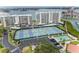 Overhead view of multiple outdoor tennis courts with lush landscaping near the harbor at 8000 Sailboat Key S Blvd # 202, St Pete Beach, FL 33707