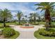 Beautifully landscaped courtyard with a decorative fountain at 8000 Sailboat Key S Blvd # 202, St Pete Beach, FL 33707