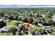 Aerial view of a charming single-Gathering home in a lush, tree-filled neighborhood at 8124 Golf Club Ct, Hudson, FL 34667