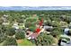 Birds eye view of a property nestled in a tree-filled area, possibly near a golf course at 8124 Golf Club Ct, Hudson, FL 34667