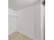 This is a small walk-in closet that is white at 8124 Golf Club Ct, Hudson, FL 34667