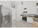 Kitchen featuring stainless steel appliances, ample counter space, and white cabinets for a modern appeal at 8124 Golf Club Ct, Hudson, FL 34667