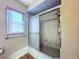Bathroom featuring updated shower with sliding glass doors and modern fixtures at 8127 Tarsier Ave, New Port Richey, FL 34653