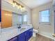 Bright bathroom with a glass shower, vanity sink, and a large mirror at 8127 Tarsier Ave, New Port Richey, FL 34653