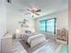 Cozy ' bedroom with plenty of natural light, soft rug, and neutral color palette at 8127 Tarsier Ave, New Port Richey, FL 34653