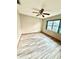 Bedroom featuring stylish floors, a ceiling fan, and natural light from the window at 8127 Tarsier Ave, New Port Richey, FL 34653