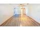 Bright, vacant room with ceiling fan and hardwood flooring at 8127 Tarsier Ave, New Port Richey, FL 34653