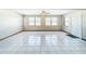Vacant room with tile flooring, mini-blinds, and a ceiling fan at 8127 Tarsier Ave, New Port Richey, FL 34653
