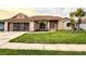 Charming single-story home with a well-manicured lawn and appealing curb appeal at 8127 Tarsier Ave, New Port Richey, FL 34653