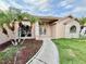 Inviting home exterior with stone accents, manicured landscaping, and a charming entrance at 8127 Tarsier Ave, New Port Richey, FL 34653
