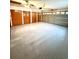 Spacious garage with painted floor, and three storage closets at 8127 Tarsier Ave, New Port Richey, FL 34653