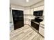 Close up of kitchen appliances and cabinetry at 8127 Tarsier Ave, New Port Richey, FL 34653