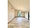 Open living room space with tile floors, chandelier, and lots of light at 8127 Tarsier Ave, New Port Richey, FL 34653