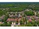 An aerial view of a home in a wooded neighborhood; property is circled in red at 8211 Canyon Creek Way, Tampa, FL 33647