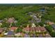 Aerial view of a home with a pool in a wooded community; property is circled in red at 8211 Canyon Creek Way, Tampa, FL 33647