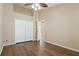 This bedroom features hardwood floors, ceiling fan and a double door closet at 8211 Canyon Creek Way, Tampa, FL 33647