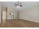 Bright primary bedroom with wood floors and an adjacent bathroom with glass block accents at 8211 Canyon Creek Way, Tampa, FL 33647