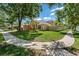 Beautiful single-story home with tropical landscaping and a fenced yard at 8211 Canyon Creek Way, Tampa, FL 33647