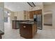 Spacious kitchen with stainless steel appliances, an island, and plenty of countertop space at 8211 Canyon Creek Way, Tampa, FL 33647