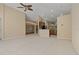 Open-concept living space with tile flooring and seamless transition to the kitchen at 8211 Canyon Creek Way, Tampa, FL 33647