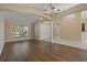 Bright living room features hardwood floors and large windows with natural light at 8211 Canyon Creek Way, Tampa, FL 33647