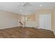 The living room features hardwood floors, staircase, ceiling fan and double door closet at 8211 Canyon Creek Way, Tampa, FL 33647