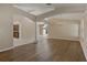 Open-concept living room with hardwood floors and elegant architectural details at 8211 Canyon Creek Way, Tampa, FL 33647