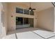 Covered patio with fan and sliding glass doors overlooking the pool area at 8211 Canyon Creek Way, Tampa, FL 33647
