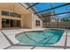 Inviting pool area enclosed in a screen, perfect for outdoor relaxation and entertaining at 8211 Canyon Creek Way, Tampa, FL 33647