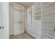 Spacious walk-in closet with custom shelving and drawers, maximizing storage and organization at 8211 Canyon Creek Way, Tampa, FL 33647