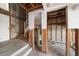 View of an unfinished basement with exposed block walls and wooden steps to the first floor at 829 E Gulf Blvd # 107, Indian Rocks Beach, FL 33785