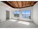 Bright bedroom featuring large windows and a view of the waterfront at 829 E Gulf Blvd # 107, Indian Rocks Beach, FL 33785