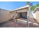 Open garage with storage shelving and brick pavement plus white fence in the background at 829 E Gulf Blvd # 107, Indian Rocks Beach, FL 33785