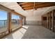 Living room being renovated featuring bright windows and waterfront views at 829 E Gulf Blvd # 107, Indian Rocks Beach, FL 33785