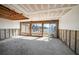 Living room being renovated featuring expansive windows and waterfront views at 829 E Gulf Blvd # 107, Indian Rocks Beach, FL 33785