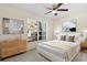 Serene bedroom with a large window, soft color palette, and minimalist furniture offering a tranquil retreat at 9922 86Th Way, Seminole, FL 33777