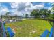 Community dog park with green grass, benches, and fenced area at 9922 86Th Way, Seminole, FL 33777