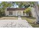 Charming single-story home featuring a welcoming entrance and mature landscaping at 9922 86Th Way, Seminole, FL 33777