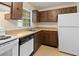 Efficient kitchen features classic cabinetry, essential appliances, and ample counter space at 9922 86Th Way, Seminole, FL 33777