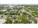 Aerial view of a neighborhood with mature trees, showcasing community layout and proximity to city amenities at 111 Orangeview Ave, Clearwater, FL 33755