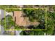 Aerial view of property with mature trees and lush landscaping, offering privacy and shade at 111 Orangeview Ave, Clearwater, FL 33755