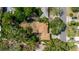 Aerial view of property with mature trees and lush landscaping, offering privacy and shade at 111 Orangeview Ave, Clearwater, FL 33755