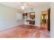 Spacious bedroom with hardwood floors, ceiling fan, natural light, and storage units at 111 Orangeview Ave, Clearwater, FL 33755