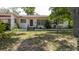 Single-story home featuring mature landscaping at 111 Orangeview Ave, Clearwater, FL 33755