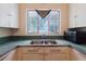 Kitchen with stainless steel sink and a window, offering a view while you work at 111 Orangeview Ave, Clearwater, FL 33755
