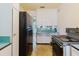 Functional kitchen with older appliances, offering a practical space for cooking at 111 Orangeview Ave, Clearwater, FL 33755