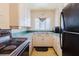 Vintage kitchen featuring classic appliances and white cabinets and tiled countertops at 111 Orangeview Ave, Clearwater, FL 33755