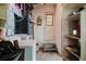 Laundry room with a washer and dryer, providing essential utility space and storage shelves at 111 Orangeview Ave, Clearwater, FL 33755