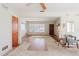Open living room with white walls, ceiling fan, front door and large windows at 111 Orangeview Ave, Clearwater, FL 33755