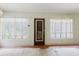 Bright living room with large windows and a screen door, flooding the space with natural light at 111 Orangeview Ave, Clearwater, FL 33755